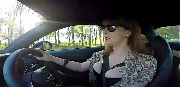  British mature Red fingers her cunt in the car again